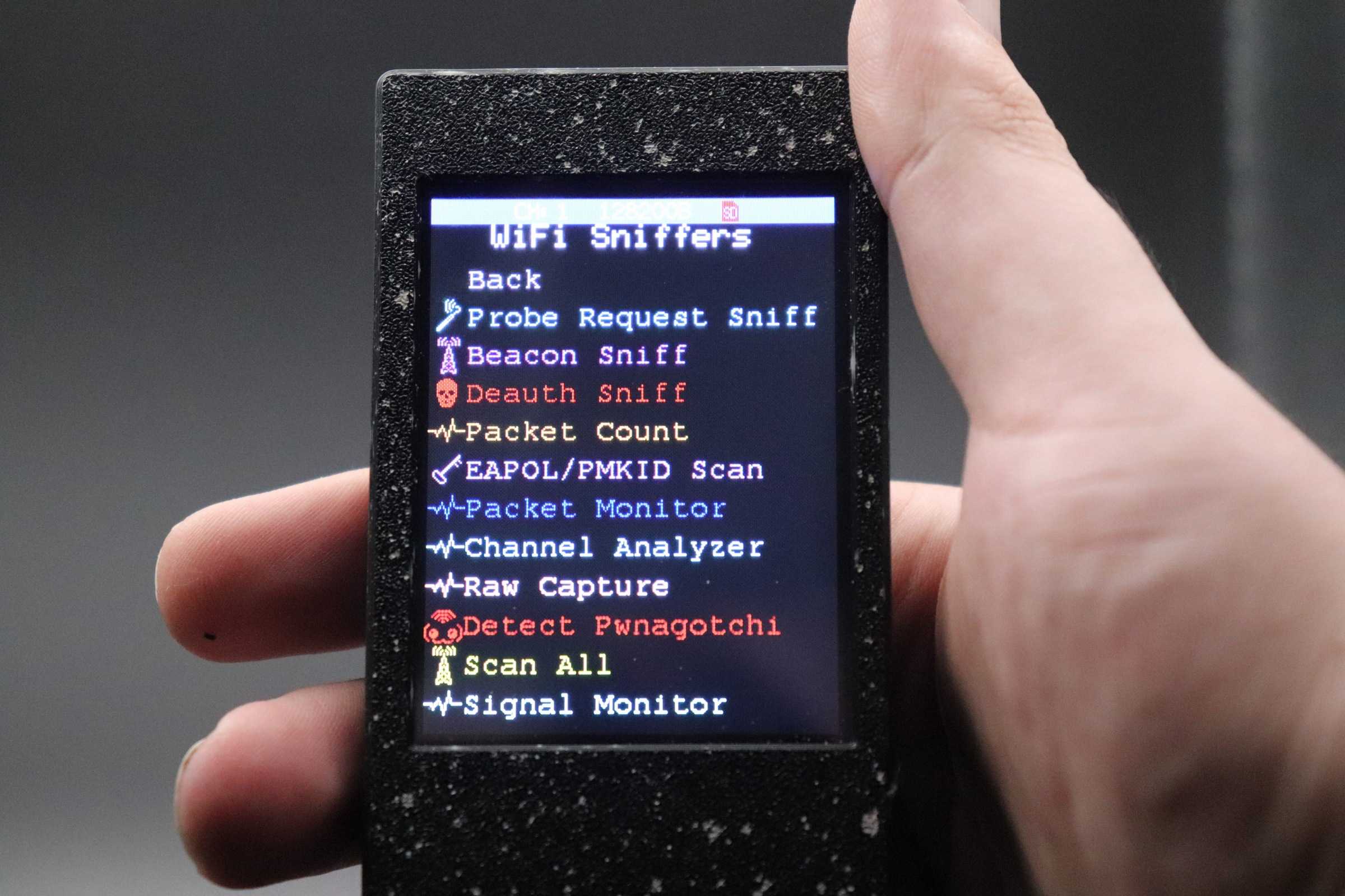 Black CYD device held in hand