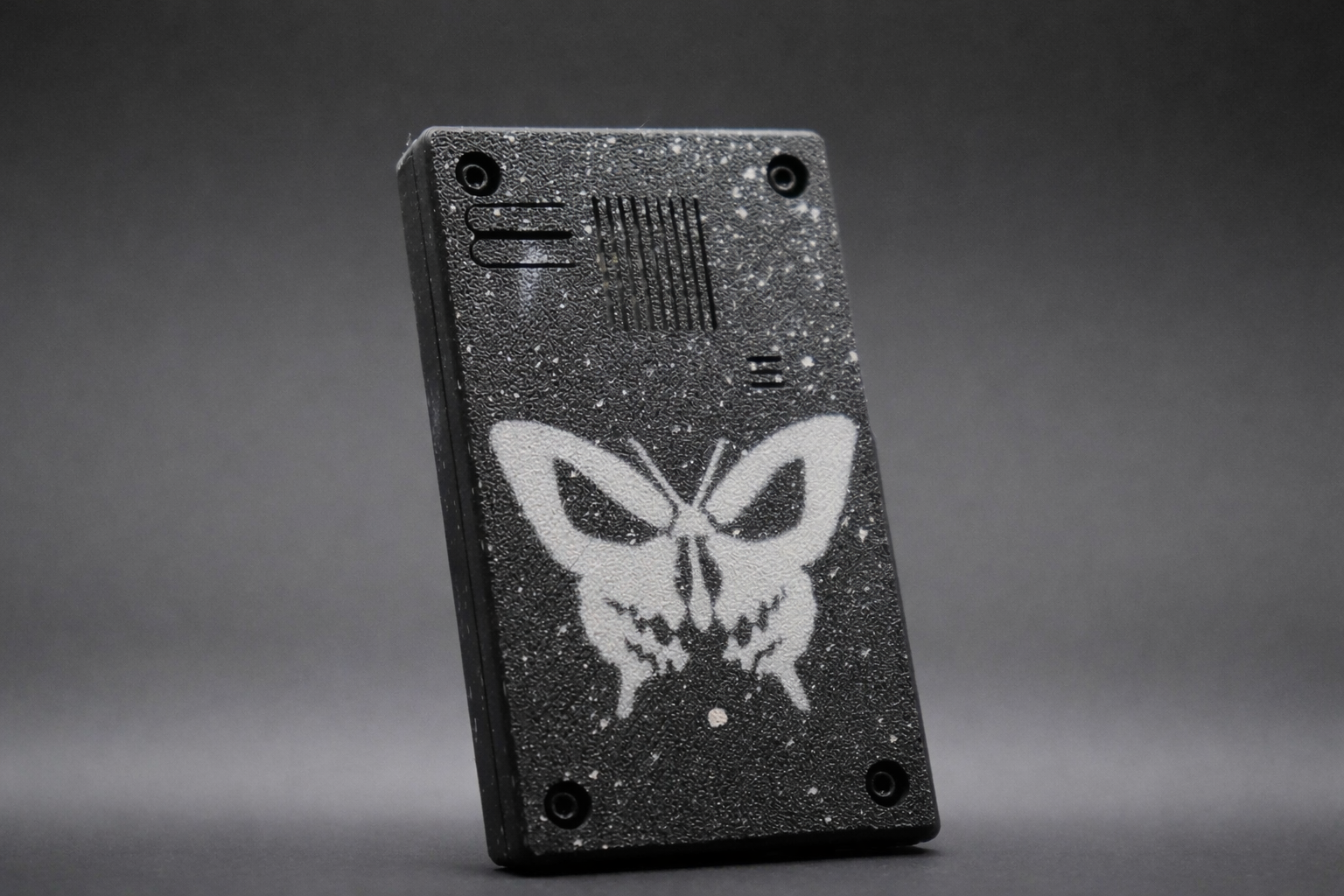 Black Skullfly stencil CYD enclosure close-up
