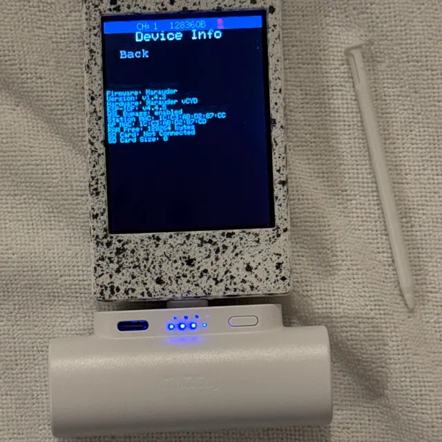 D review photo showing a white CYD wireless toolkit connected to a compact power bank