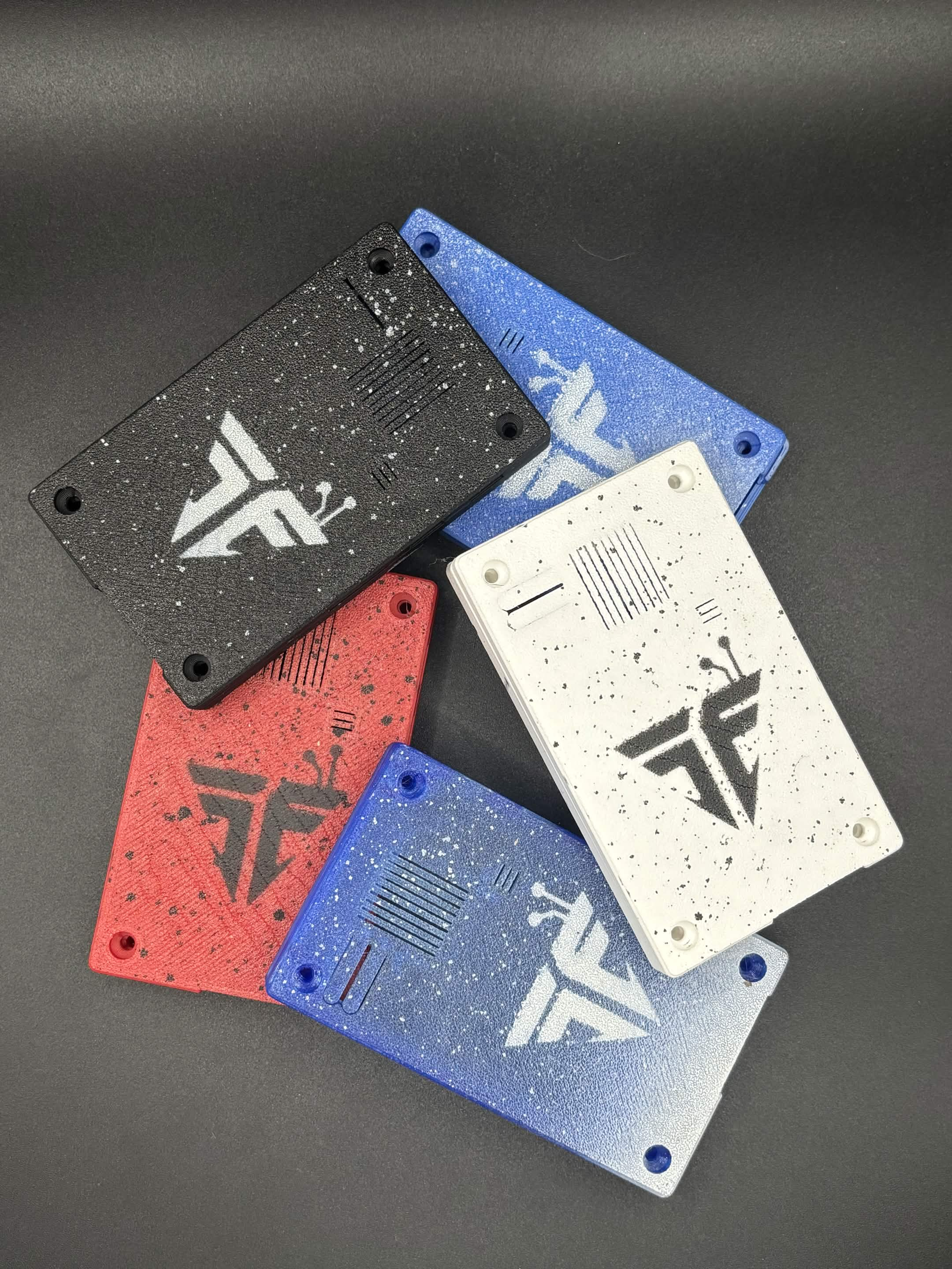 TraceFinish logo case backs in black, blue, red and white finishes