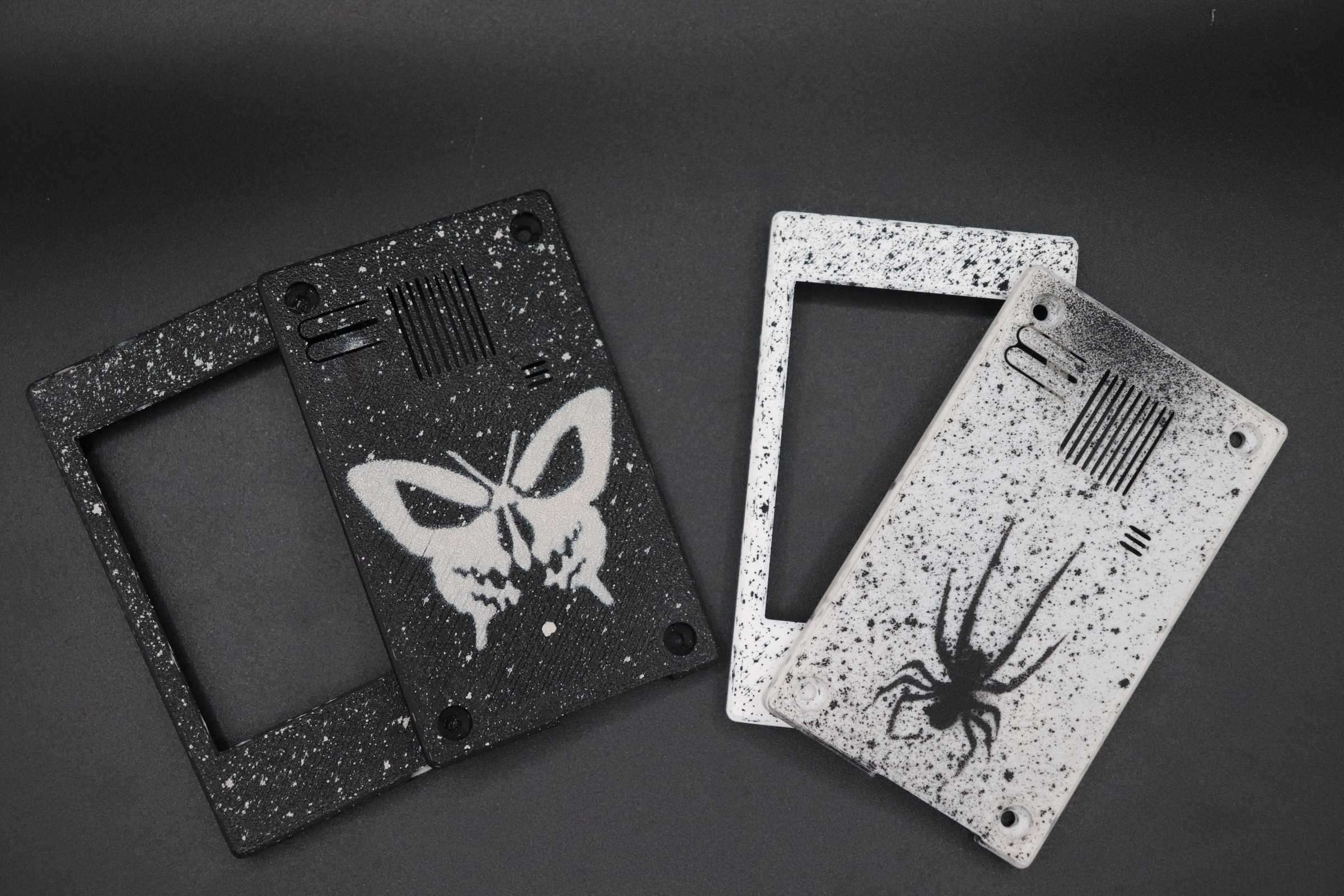 Black Skullfly and white Spider custom painted case examples